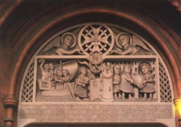 Photo:Carved relief above doorway of the French Protestant Church, Soho Square. This stone relief was erected at the church in 1950, to celebrate the 400th anniversary of the opening of the first French Protestant Church in Threadneedle Street in 1550. It shows the Huguenots leaving France, arriving at Dover and receiving a charter from King Edward VI granting them asylum.